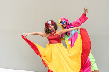 Colorful dancers joyfully performing at carnival in traditional attire