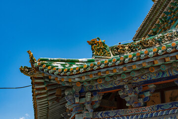 Looking up at the eaves of Feihong Glazed Tower of Guangsheng Temple in Linfen, Shanxi, you can see...