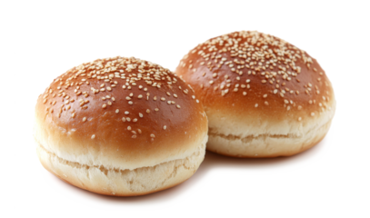 Two sesame seed burger buns isolated on a white or clear background.