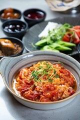 Delicious menemen served with side dishes for turkish breakfast