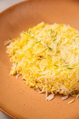 Saffron rice being served on a plate