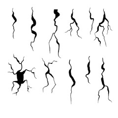 Fototapeta premium A collection of cracks spreading across a surface, resembling shattered glass or cracked ground. The black and white design gives a sense of brokenness or damage