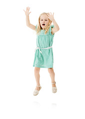 Studio, child and girl with energy for jump, hands up and fashion dress for first day of kindergarten. Space, kid and development with flying game for playing with balance and white background