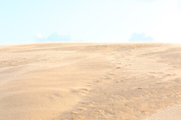 wind whipping sand from the sandy desert dunes