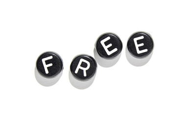 Black keyboard keys spelling free with shadows on white background symbolizing freedom and creativity