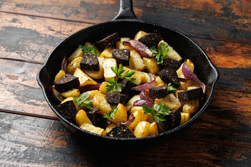 Black pudding or blood sausage warm salad with vegetables