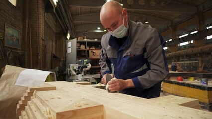 Craftsman Dedicatedly Working in a Wood Workshop, Showcasing Their Expertise in Craftsmanship. Stock Clip