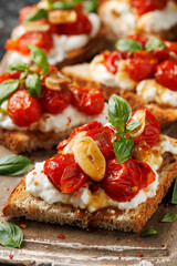 Cottage cheese and roasted tomatoes sourdough bread toast on a wooden board.