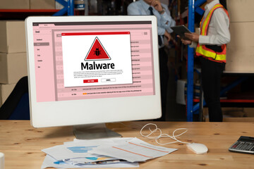 Cyber attacking concept. Malware alert showing on computer screen display scam and threat detection on computer system or online server to be removed snugly.