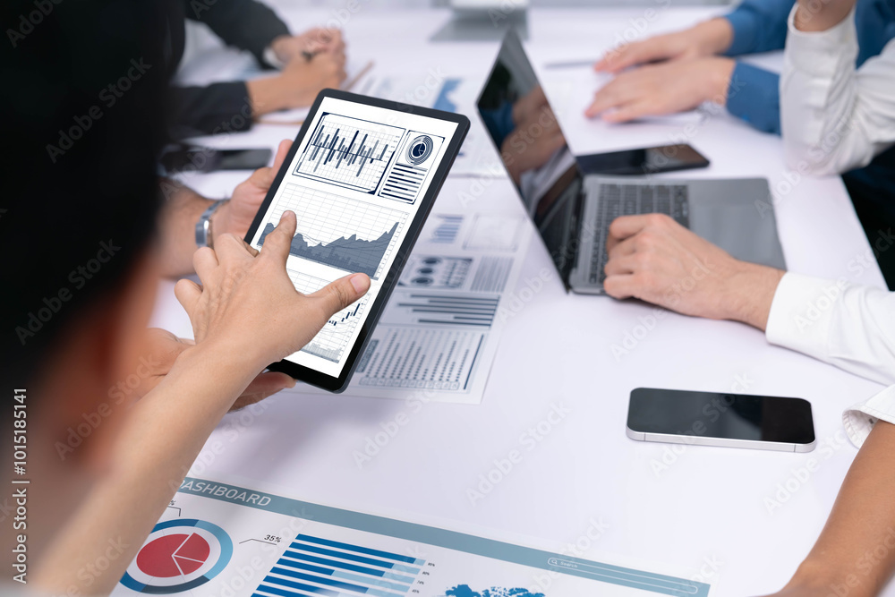 Leinwandbilder Analyst team uses BI Fintech display tablet to analyze financial data . Business people analyze BI software technology dashboard power for insights power into business marketing planning. Prudent