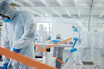 People, disinfection or investigation team with hazmat suit for cleaning, health and safety in...