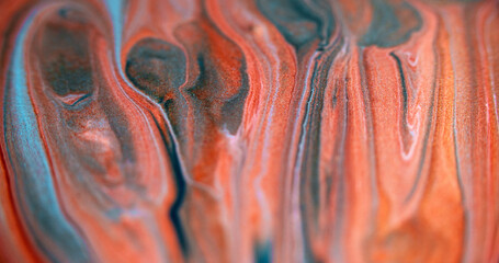 Sparkling paint spill. Fluid splash. Blur red orange blue color sparkling particles texture ink drip cascade abstract art background. © golubovy