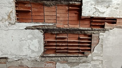 Pared de ladrillo destruida pintura desgastada 