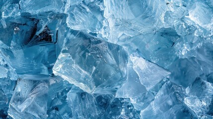 Obraz premium Close-up of blue ice cubes with light reflections. Concept of freshness and cold texture.