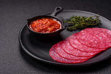 Delicious smoked salami sausage with salt, spices and herbs