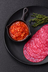 Delicious smoked salami sausage with salt, spices and herbs