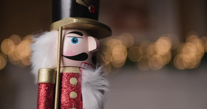 celebrate the holidays with this stunning Nutcracker figurine spinning amidst dreamy bokeh lights, creating a perfect festive atmosphere