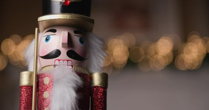 charming Nutcracker figurine standing still in front of glowing bokeh lights, creating a perfect touch of holiday spirit