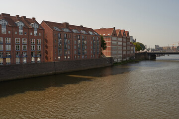 Fototapeta premium Bremen, Germany - September 1, 2024 - brick buildings at Teerhof on a sunny summer day
