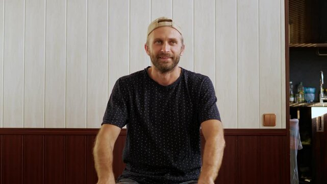 A passionate male business coach records a motivational video in his office. He delivers inspiring content but occasionally stumbles over his words, requiring him to restart and re-record segments