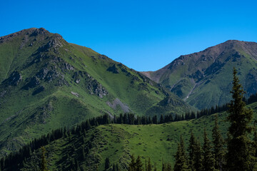 Obraz premium The tourist route to the alpine lake is not far from Almaty. On the way to the Big Almaty Lake