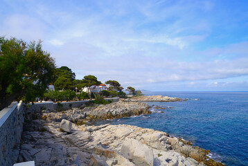 view from the famous Camí de Ronda hiking trail along the coast of the Mediterranean Sea at S'Agaró towards Palamos, Platja d'Aro, GIrona, Costa Brava, Catalonia, Spain