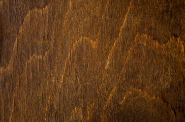 A photo of the texture of natural ebony.The table top is made of dark wood.