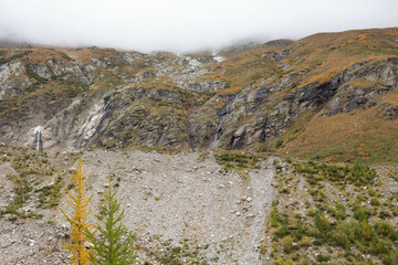 Autumn mountains. Nature. Mountain waterfall.