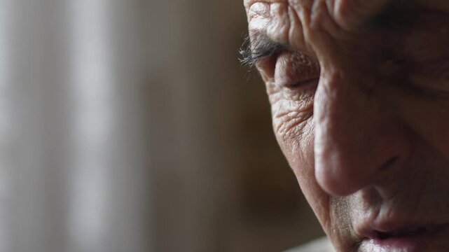 serious puzzled caucasian elderly man 70 years old dialing number on phone and making call, upset pensioner dialing number and calling on important matter