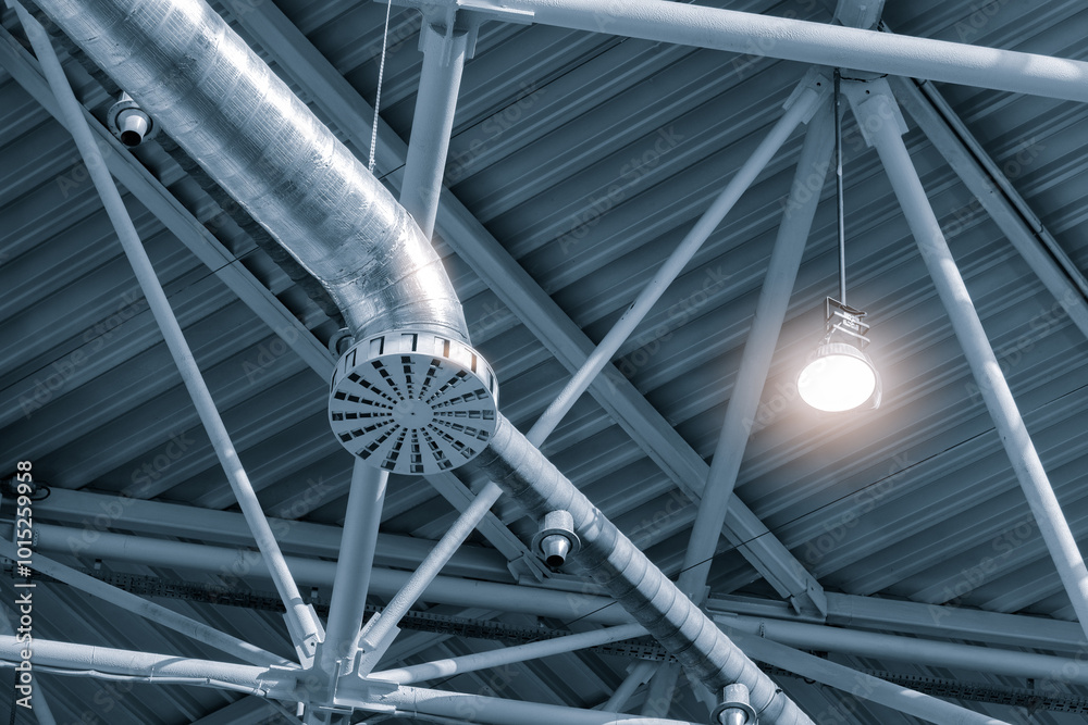 Aufkleber a light is shining on a metal structure with a camera on it. the structure is a ventilation system