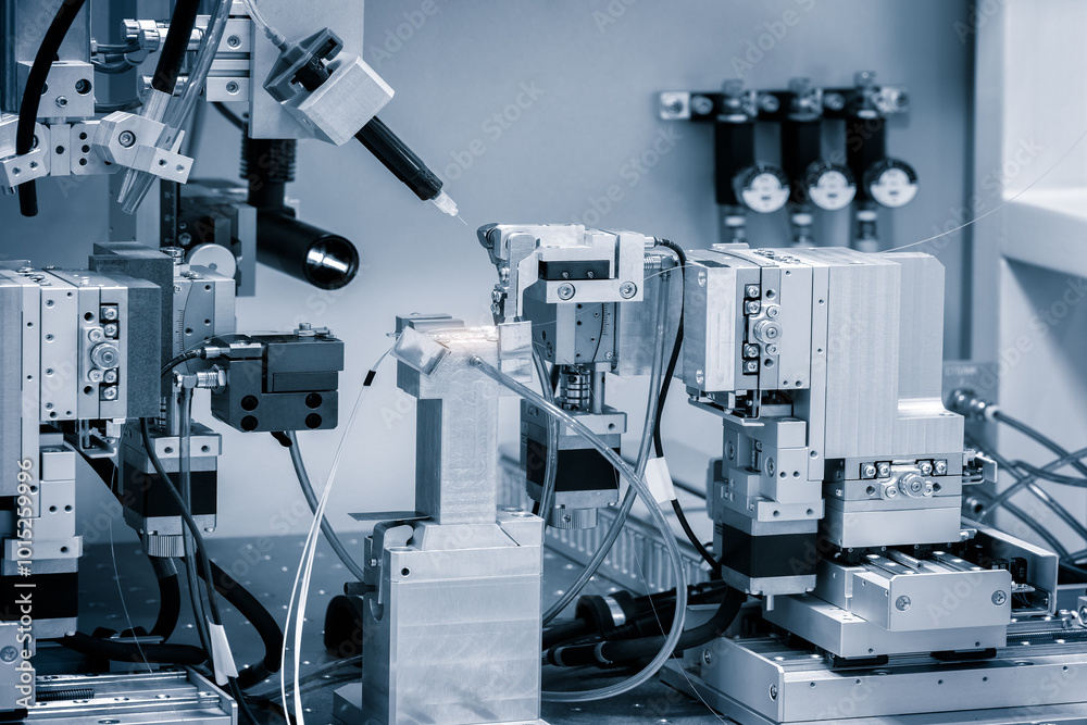 Aufkleber A machine with a lot of wires and tubes is in the middle of a room. The machine is surrounded by other machines and wires. The room is filled with a sense of technology and innovation