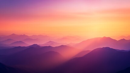 Obraz premium A panoramic view captures a breathtaking mountain range under a vibrant sunset. Rich oranges and purples fill the sky, creating a serene and majestic backdrop