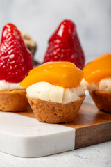 Fruit tartlet dessert on gray background