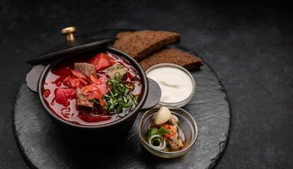 Red borscht with meat, sour cream and black bread