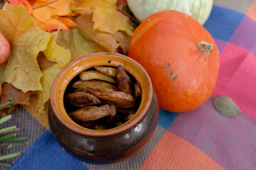 still life of pumpkins, apples on a tablecloth in autumn