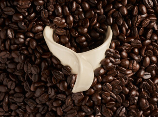 Closeup, cup and organic coffee beans for production, latte and agriculture with brewing process. Sustainability, natural and eco friendly farming with caffeine mug for beverage, roast and espresso