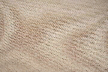  texture of knitted light brown sweater, close-up texture of beige knitted fabric, macro texture of tan knitted woolen clothes