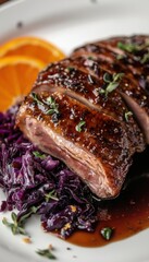 Fototapeta premium Gourmet Roasted Duck Breast with Braised Red Cabbage and Orange Garnish