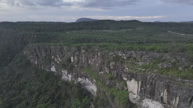 Drone approaches Pedra Mao de Deus from the south at sunset in Tepequem, Roraima, Brazil