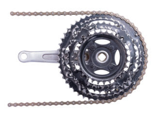 Old worn out front bicycle sprocket with chain installed. Isolated background.