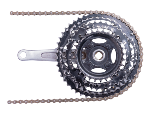 Old worn out front bicycle sprocket with chain installed. Isolated background.