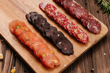 Close-up of sliced salami with nuts, gourmet meat textures and flavors, charcuterie boards