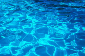 water in swimming pool rippled water detail background