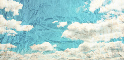 Grunge blue sky and white clouds with vintage effect.