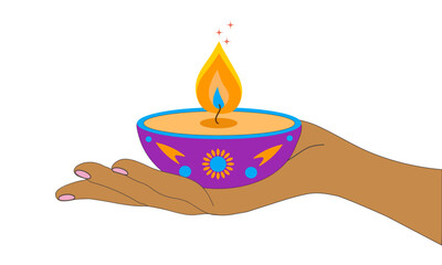 Diwali festival. An Indian girl's hand holding an oil lamp. The concept of the festival of light