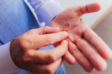 wedding rings in hands