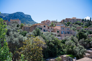 Deia, Mallorca cityscape with Serra de Tramuntana mountain landscape in the background, majorca spain