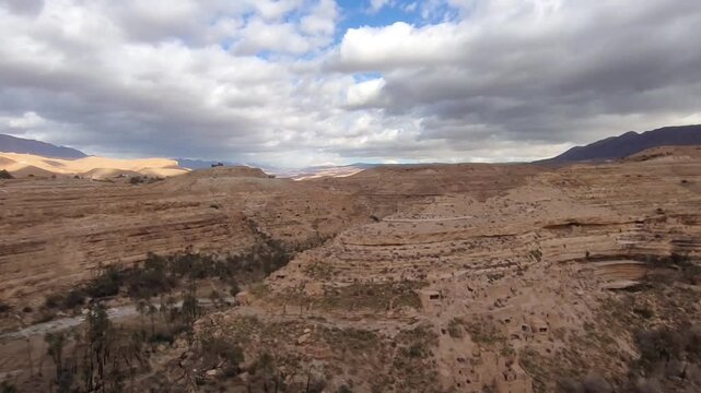 The balconies of Ghoufi, an ancient Berber village, with the remains of stone and clay houses, dug into the rocks of the canyon crossed by the Abiod River. Batna. Algeria