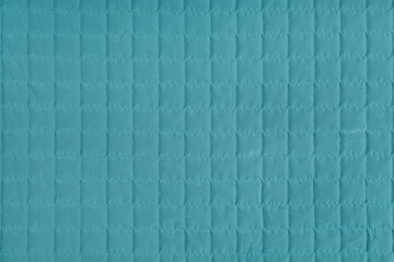 Naklejka premium Checkered stitching pattern, turquoise quilted fabric background. Blanket stitch square texture