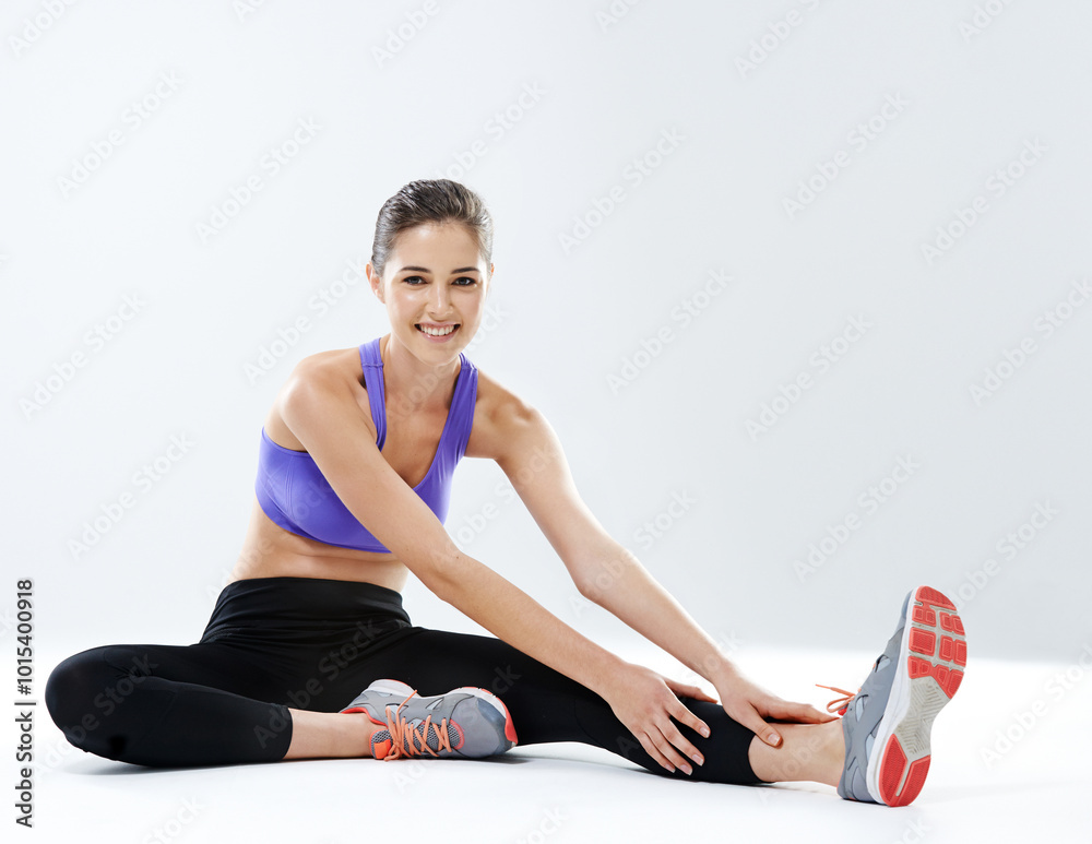 Poster Girl, smile or stretching leg in studio for flexibility for physical health, fitness training or exercise. White background, muscle warm up or happy athlete woman with wellness, workout or sports